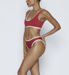 Swimwear Top. Pullover bikini sport bra style top  in ruby red with White contrast binding outline. Bikini bottom. Mid to High Waisted Swimwear bottom in ruby red with White. Medium to full coverage bikini bottom. High Legs swimsuit bottom. Check out our fashion boutique swimsuit online shop. supper soft fabric Nylon/spandex. sport bikini