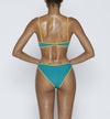 Swimwear Square neck bikini top in emerald green color with yellow contrast binding outline. Adjustable bikini straps. soft swimwear fabric. High legs bikini, high rise bikini bottom. Cheeky coverage swimwear bottom. Shop bikini online.