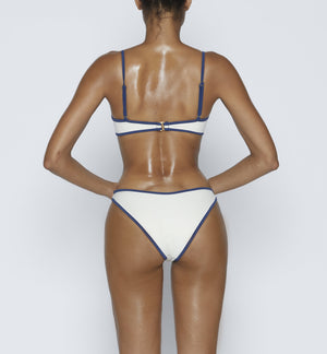 Swimwear Square neck bikini top in "Off White" color with " Blue " contrast binding outline. Adjustable bikini straps. soft swimwear fabric. High legs bikini, high rise bikini bottom. Cheeky coverage swimwear bottom. Shop bikini online.