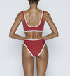 Swimwear Top. Pullover bikini sport bra style top  in ruby red with White contrast binding outline. Bikini bottom. Mid to High Waisted Swimwear bottom in ruby red with White. Medium to full coverage bikini bottom. High Legs swimsuit bottom. Check out our fashion boutique swimsuit online shop. supper soft fabric Nylon/spandex. sport bikini